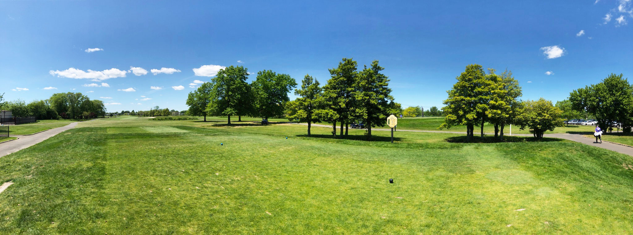 A panorama of Santapogue Creek Golf Course on a sunny day
